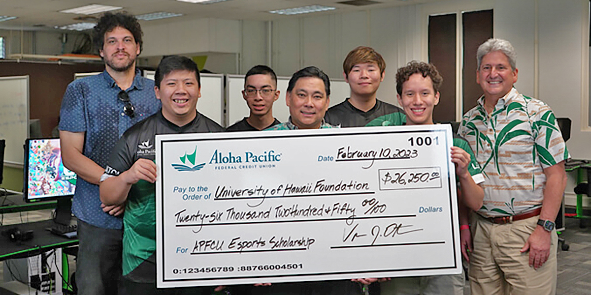 UH Esports students with check