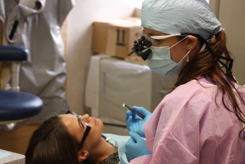 Students Andrea Hetherington in scrubs and Krystal Hayes acting as the "patient" practice their skills. Students Andrea Hetherington in scrubs and Krystal Hayes acting as the "patient" practice their skills.
