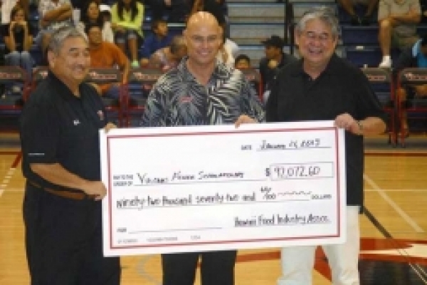  Barry Taniguchi, KTA Superstores and HFIA representative, Dexter Irvin, UH Hilo Athletics Director, and Derek Kurisu, KTA Superstores and HFIA representative.