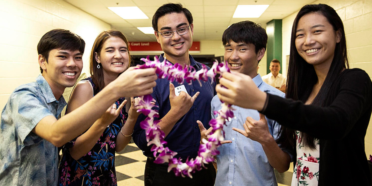 Scholarship recipients with lei