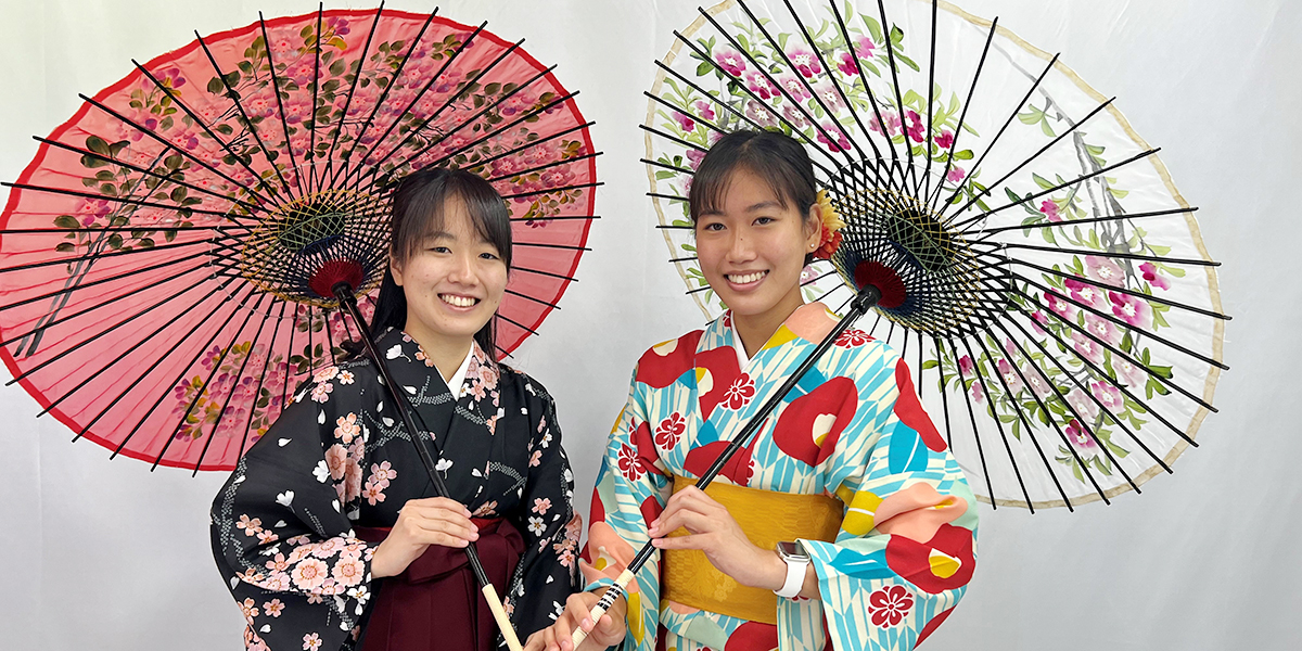 Marcy Tokunaga posing with friend in traditional Japanese attire