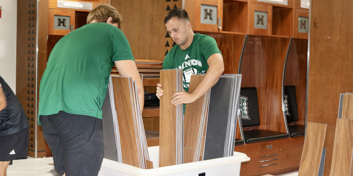 student athletes assisting locker room renovations