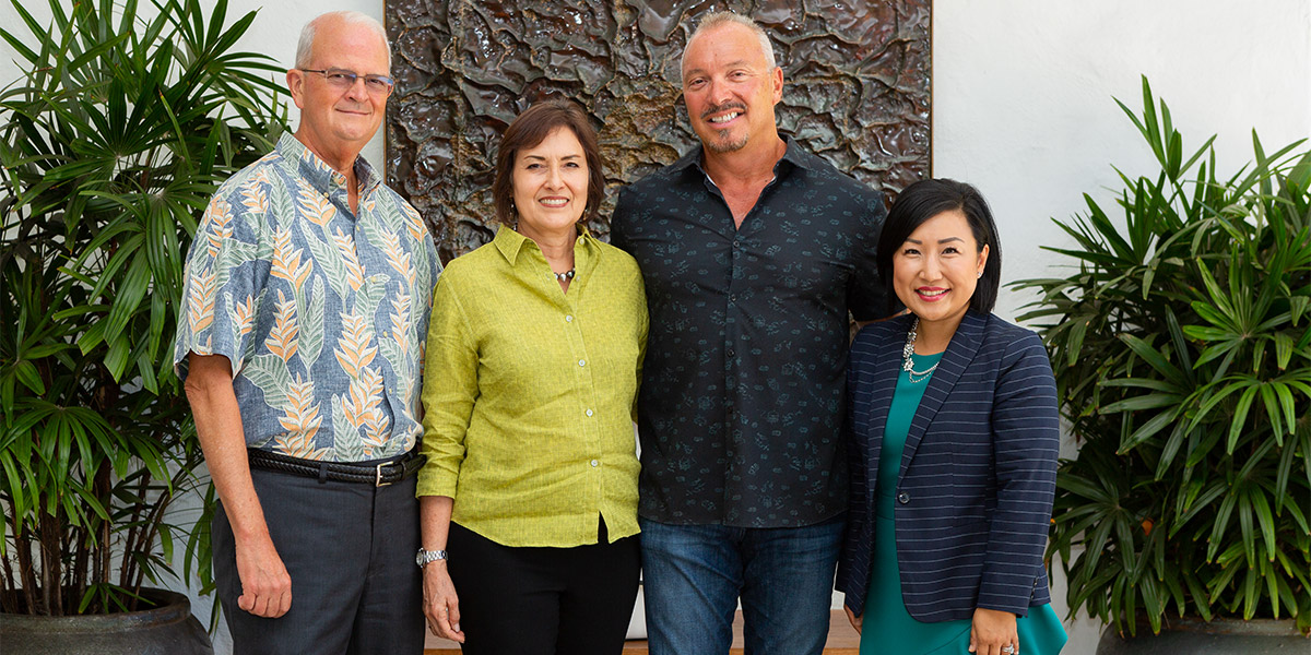 From left, Vance Roley, dean, Shidler College of Business; Jo Anne and Keith Vieira; and Unyong Nakata, executive director of development.
