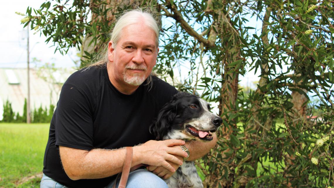 Dr. Philippe Binder of the University of Hawaii, Hilo, with his dog, Peppers.