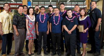 First Hawaiian Bank representatives Ben Akana, Joyce Borthwick, and Sharon Shiroma Brown congratulated students at the 2016 Summer Auto Academy graduation.
