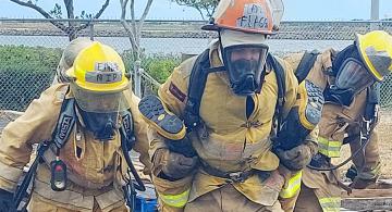 Koa Flagg and fellow firefighters