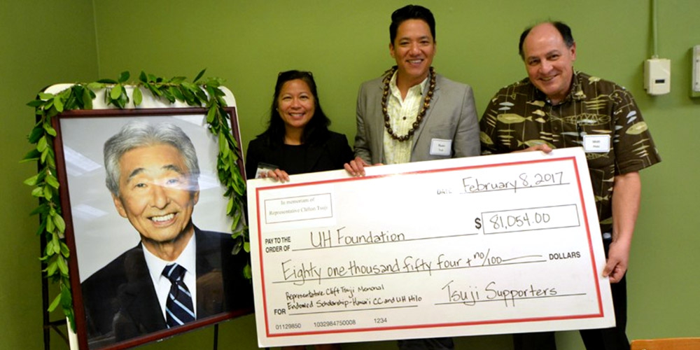 Hawai&#039;i Community College Chancellor Rachel Solemsaas, Rep. Clift Tsuji’s son Ryan Kalei Tsuji, and UH Hilo Vice Chancellor for Academic Affairs Matt Platz celebrate a generous donation of $81,054 from 159 donors contributing to newly established scholarship funds in memory of Rep. Clift Tsuji.